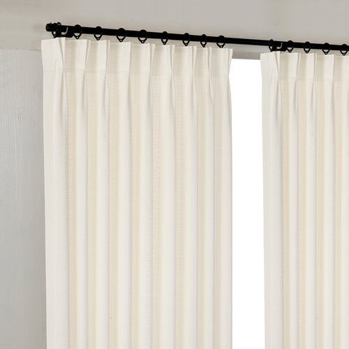 Ansel Eyelet Weave Curtains in Chalk, hanging at the window
