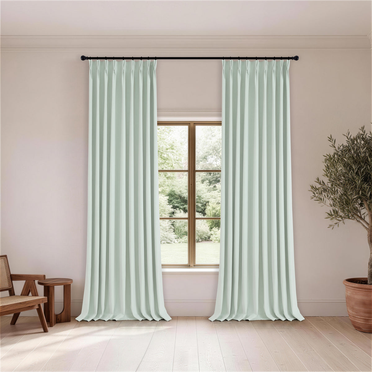 Cordelia Sculpted Chenille Blackout Curtains in Seafoam, hanging in a room