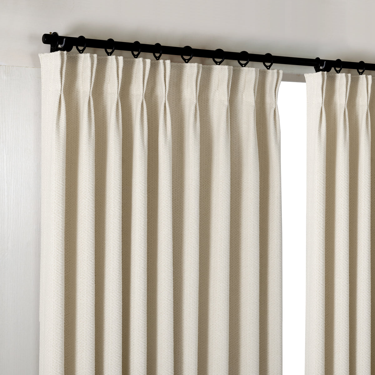 Pembroke Chevron Weave Curtains in Oat, hanging at the window