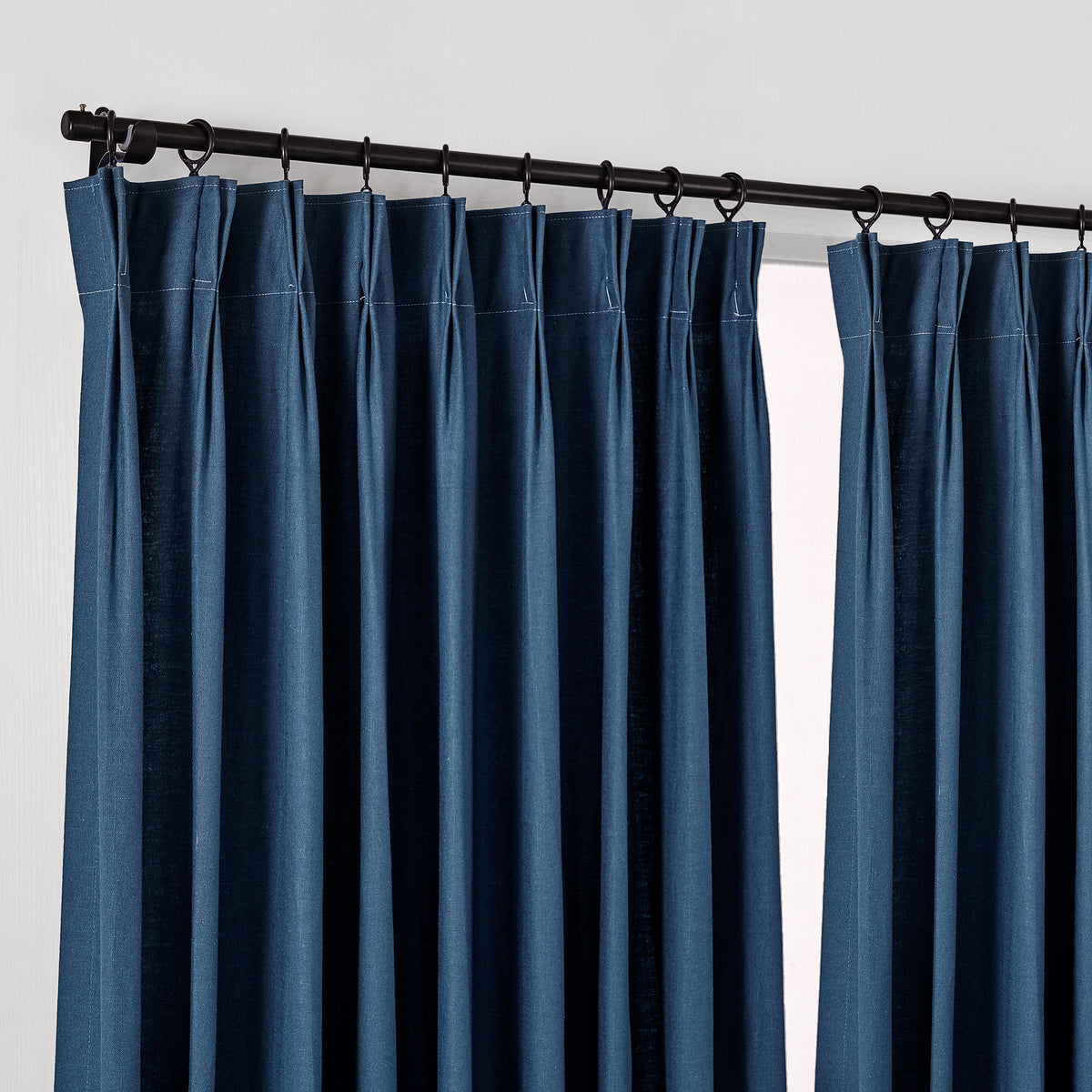 Edwina Linen-Cotton Curtains in Navy, hanging at the window