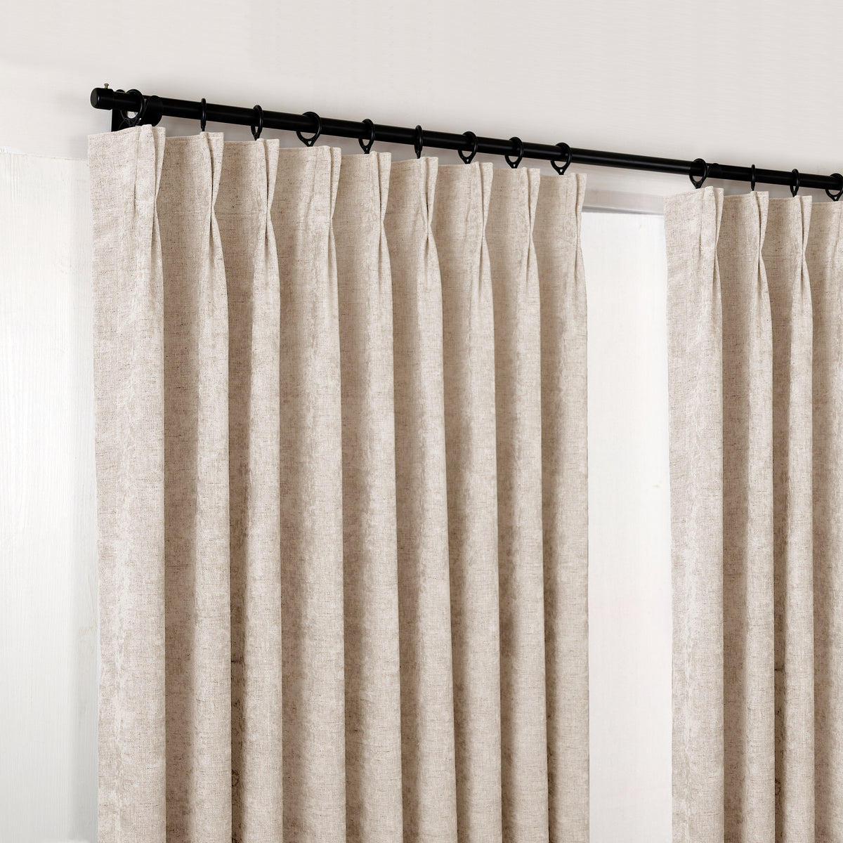 Prentiss Reversible Slub Curtains in Greige, hanging at the window