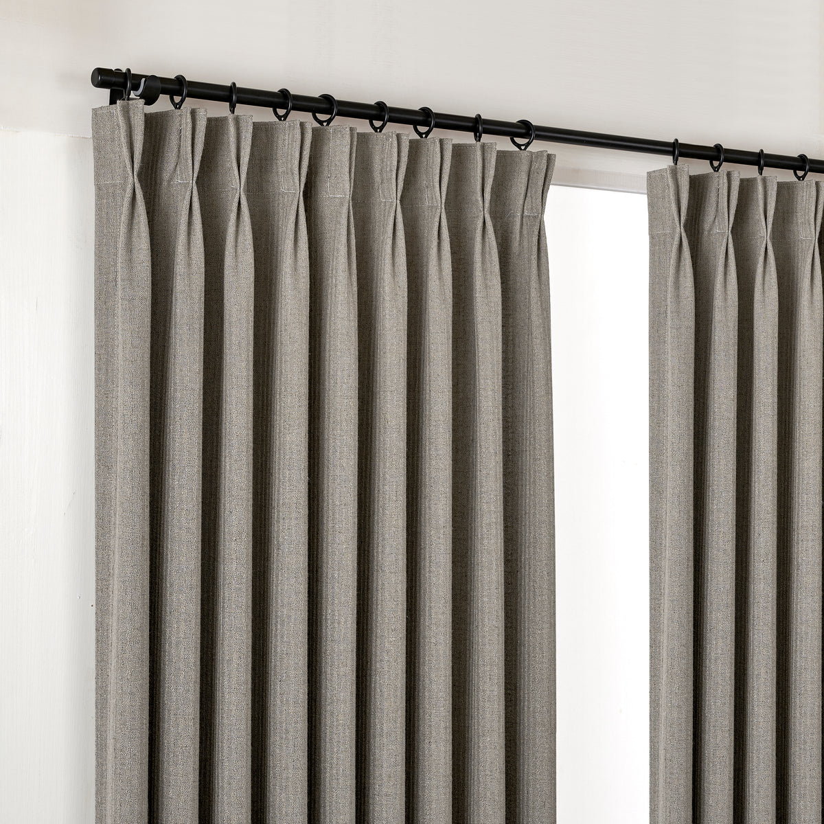 Ansel Slub Weave Curtains in Charcoal, hanging at the window