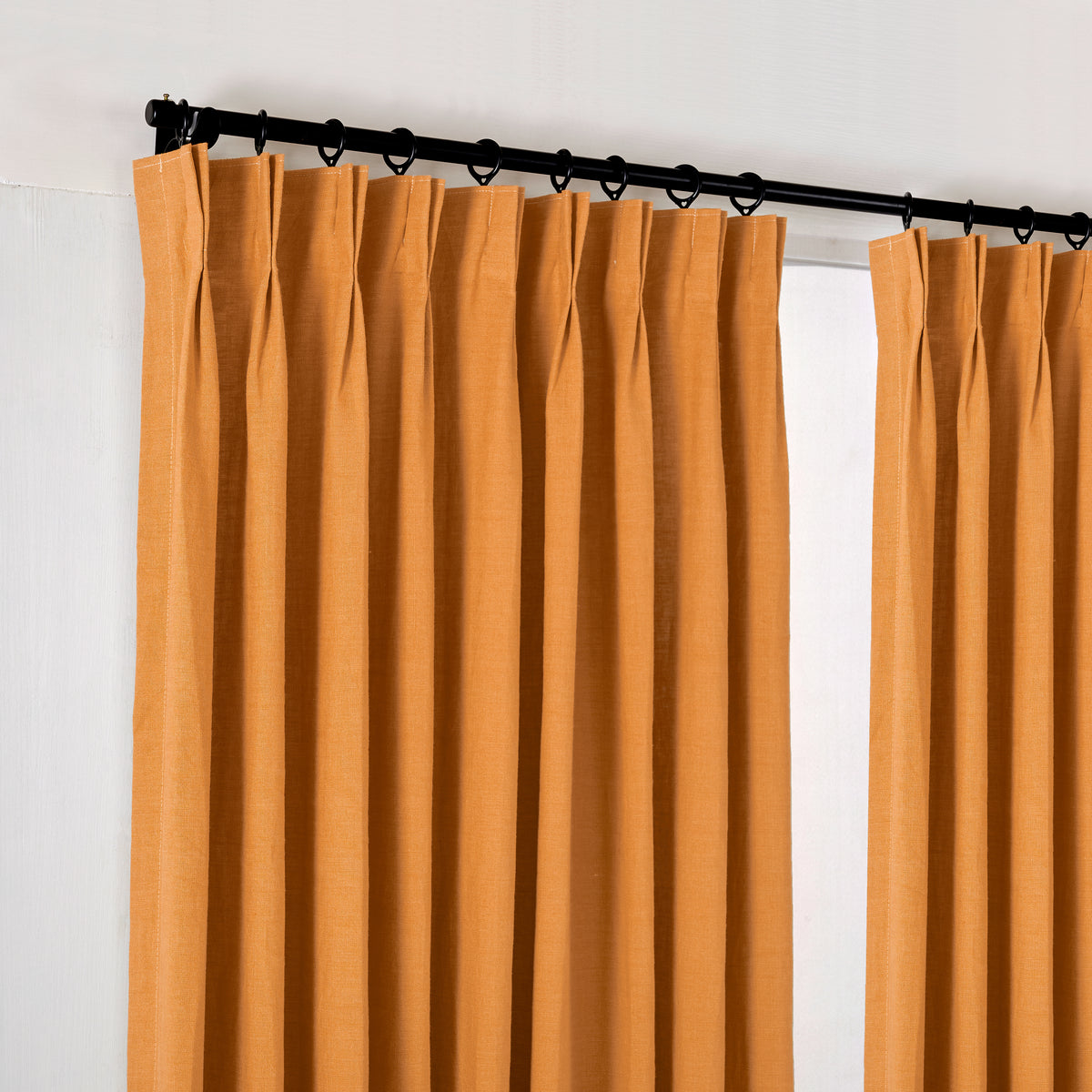 Ainsley Pure Linen Curtains in Terracotta, hanging at the window