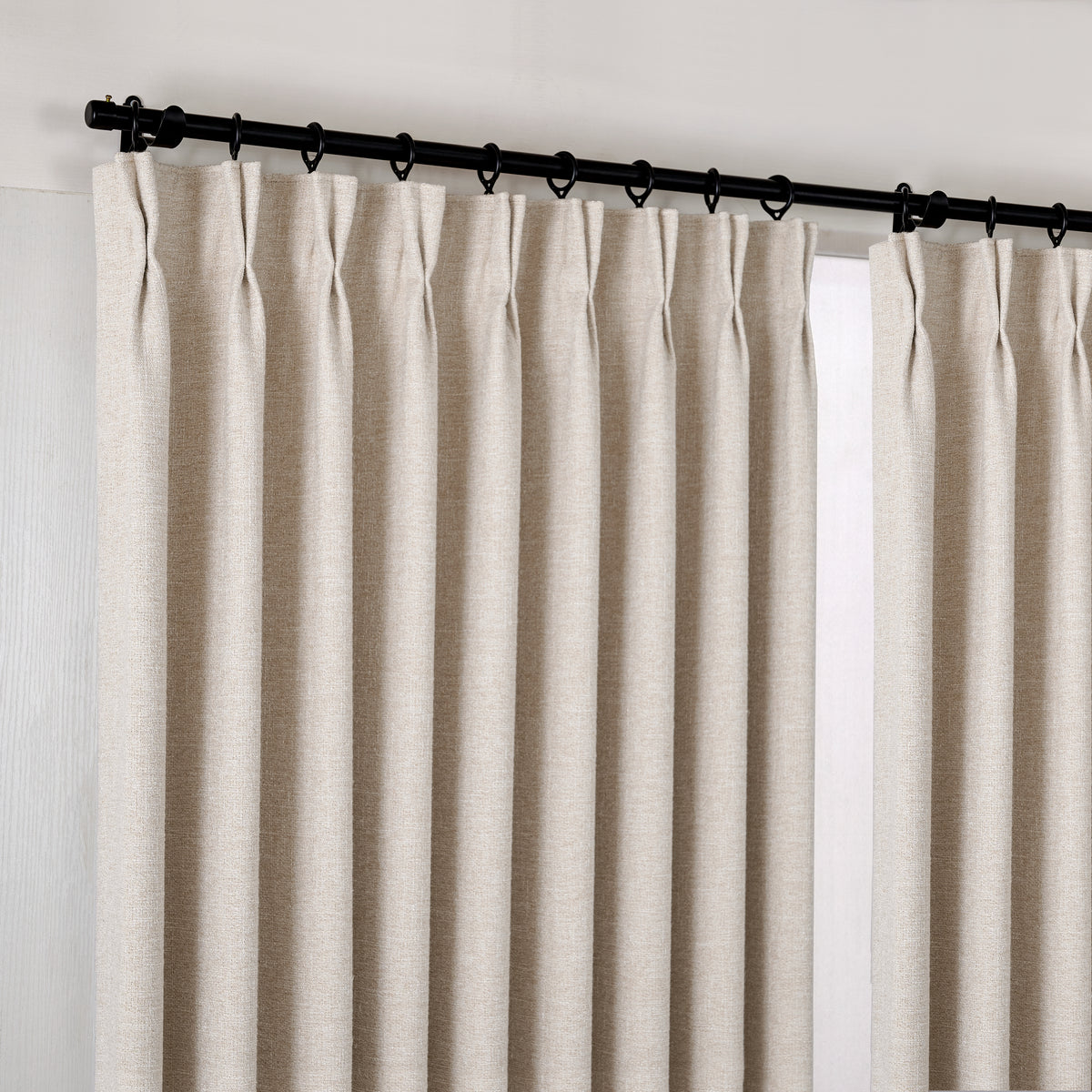 Tamsin Melange Weave Blackout Curtains in Ivory, hanging at the window