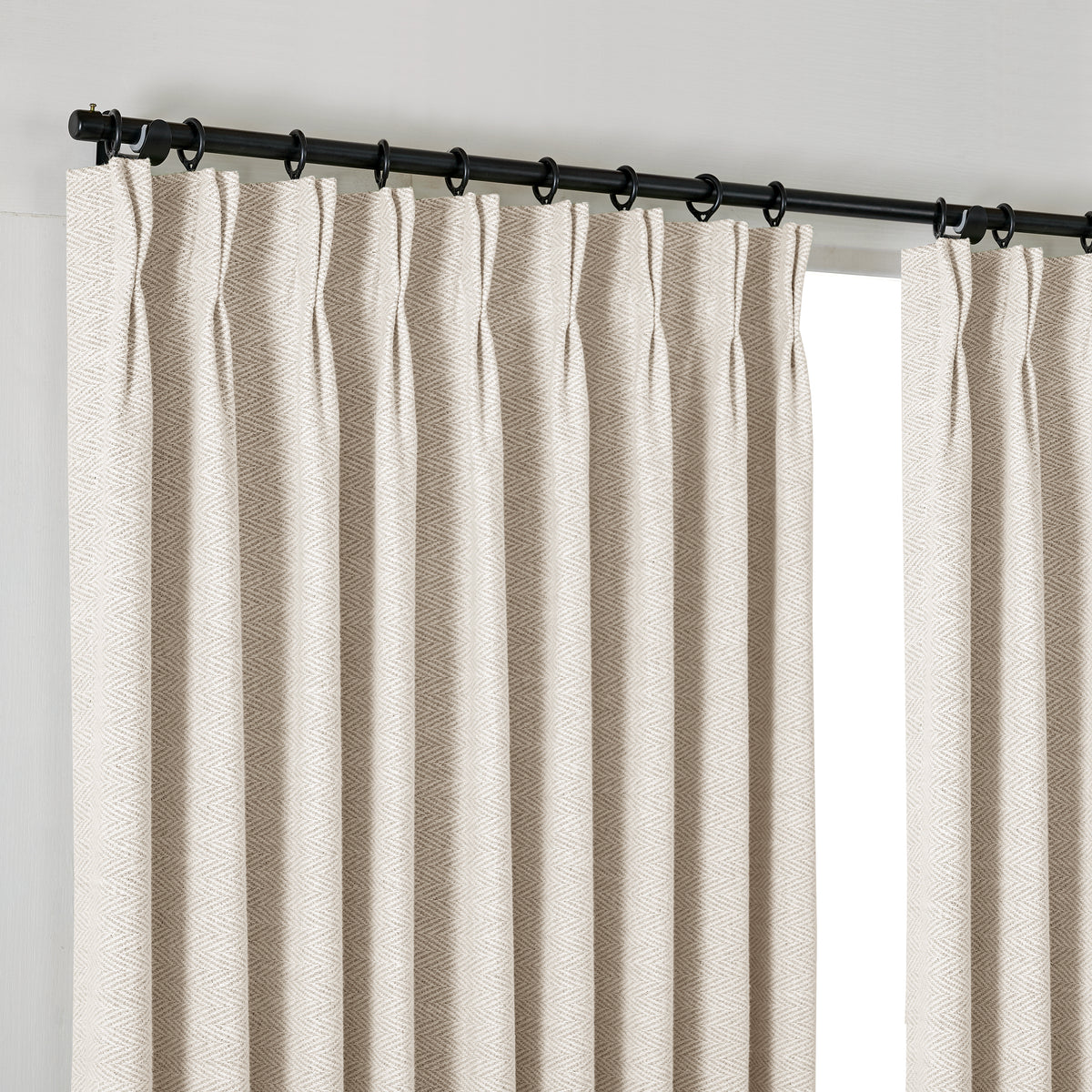 Pembroke Herringbone Weave Curtains in Pale Greige, hanging at the window