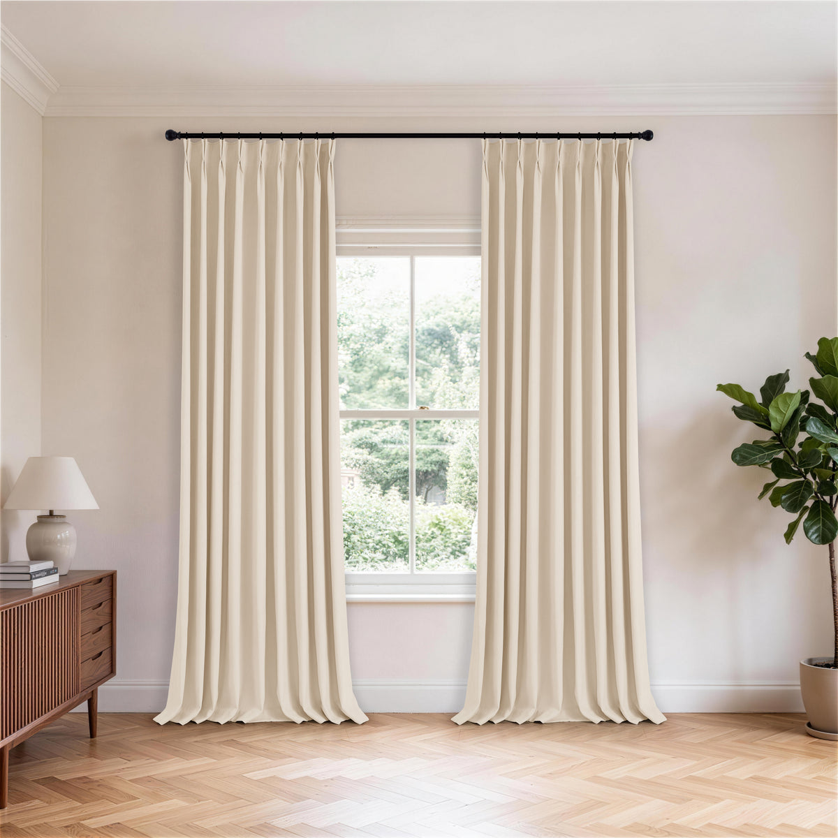 Cordelia Sculpted Chenille Blackout Curtains in Greige, hanging in a room