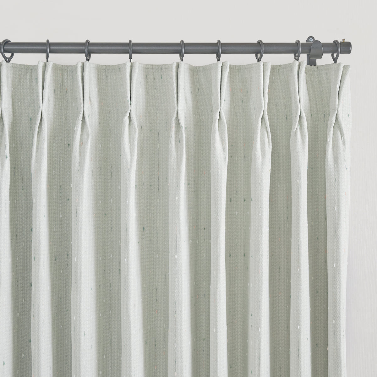 Clarice Tonal Jacquard Blackout Curtains in Light Green, pleated header close up