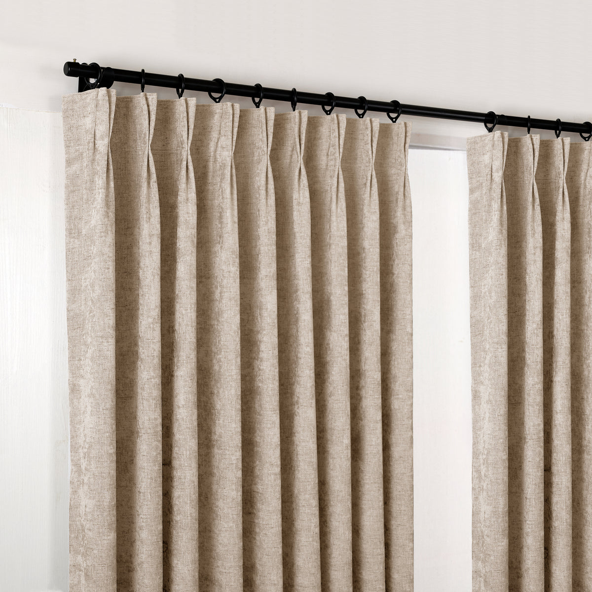 Prentiss Reversible Slub Curtains in Stone, hanging at the window