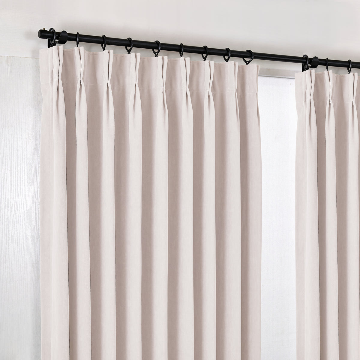 Genevieve Cloud-Soft Chenille Blackout Curtains in Cool Greige, hanging at the window