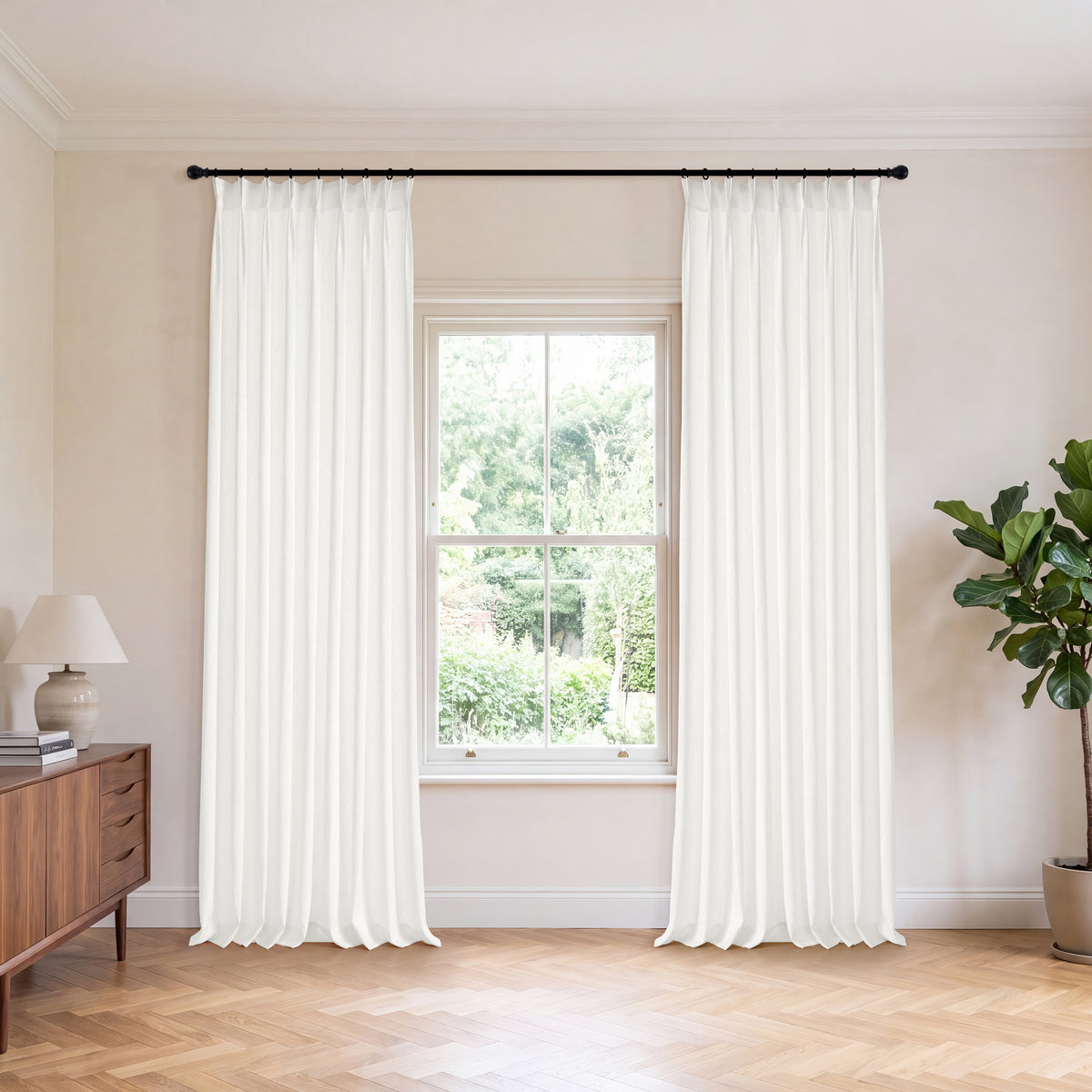 Odile Reed Sheer Curtains in White, hanging in a room