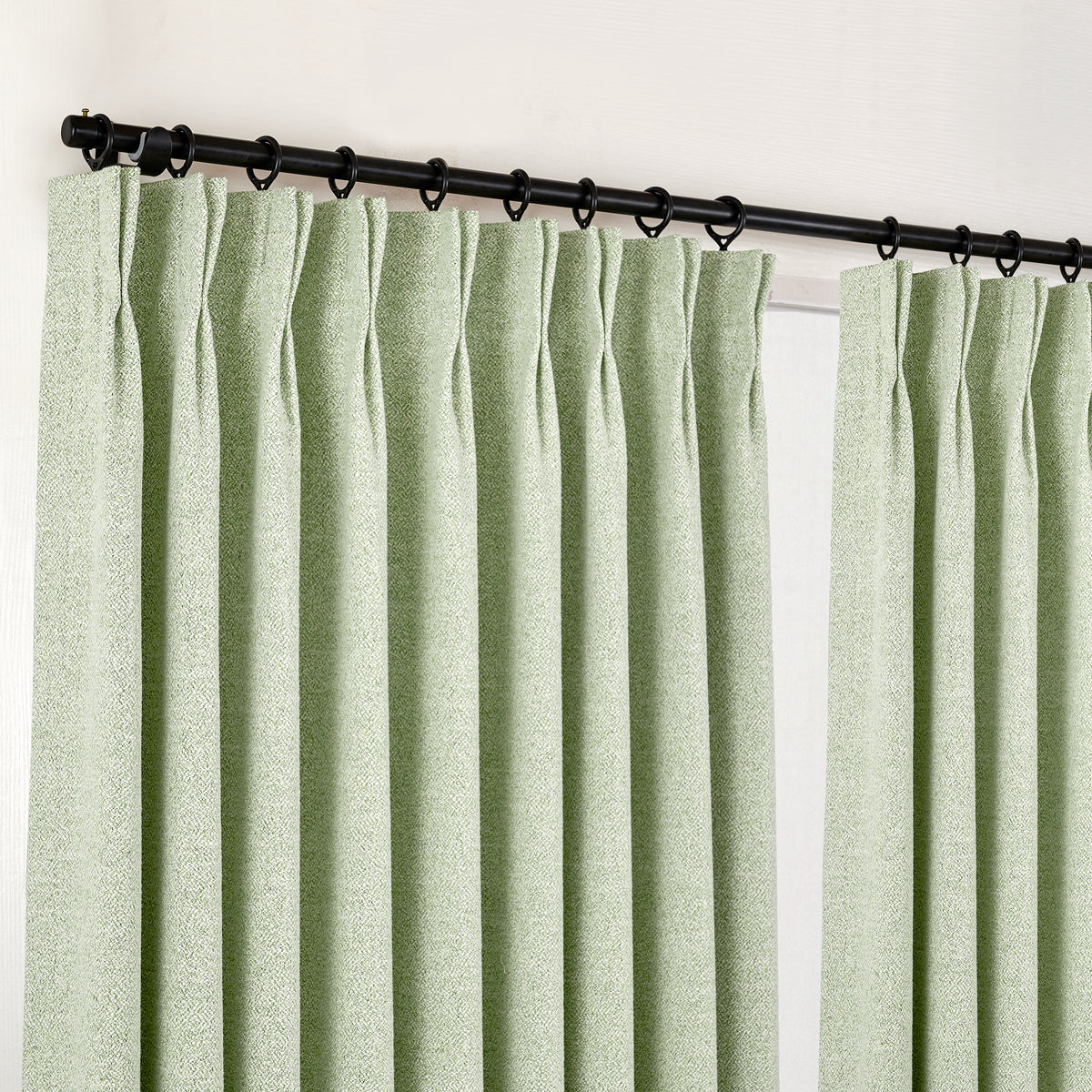 Pembroke Flecked Weave Curtains in Pale Sage, hanging at the window