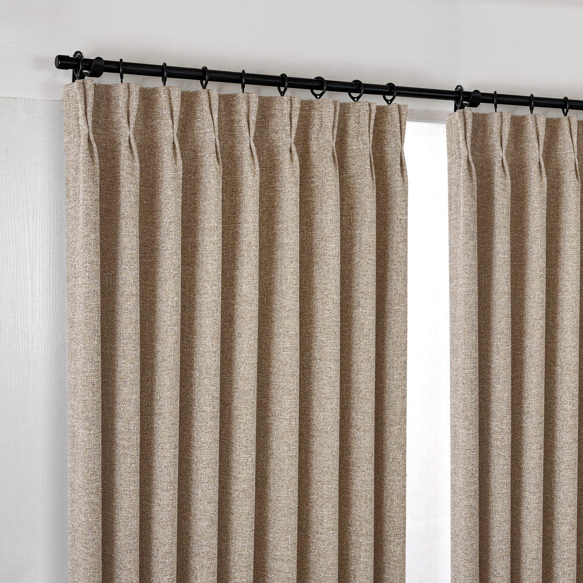 Tamsin Melange Weave Blackout Curtains in Warm Flax, hanging at the window