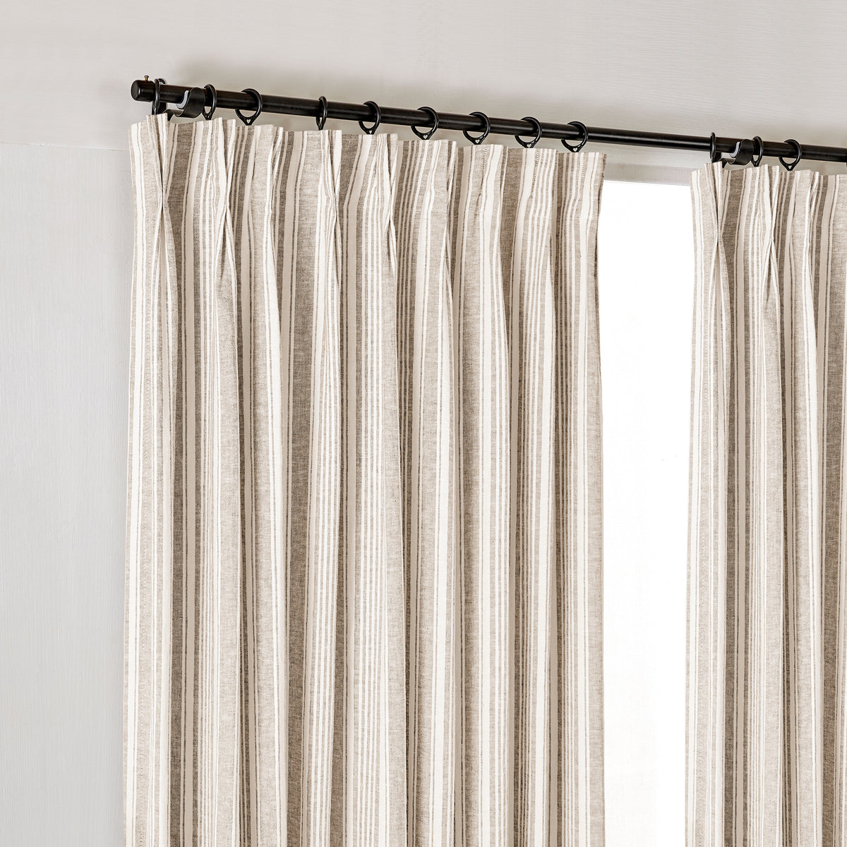 Carrick Striped Pure Linen Curtains in Flax Ticking, hanging at the window