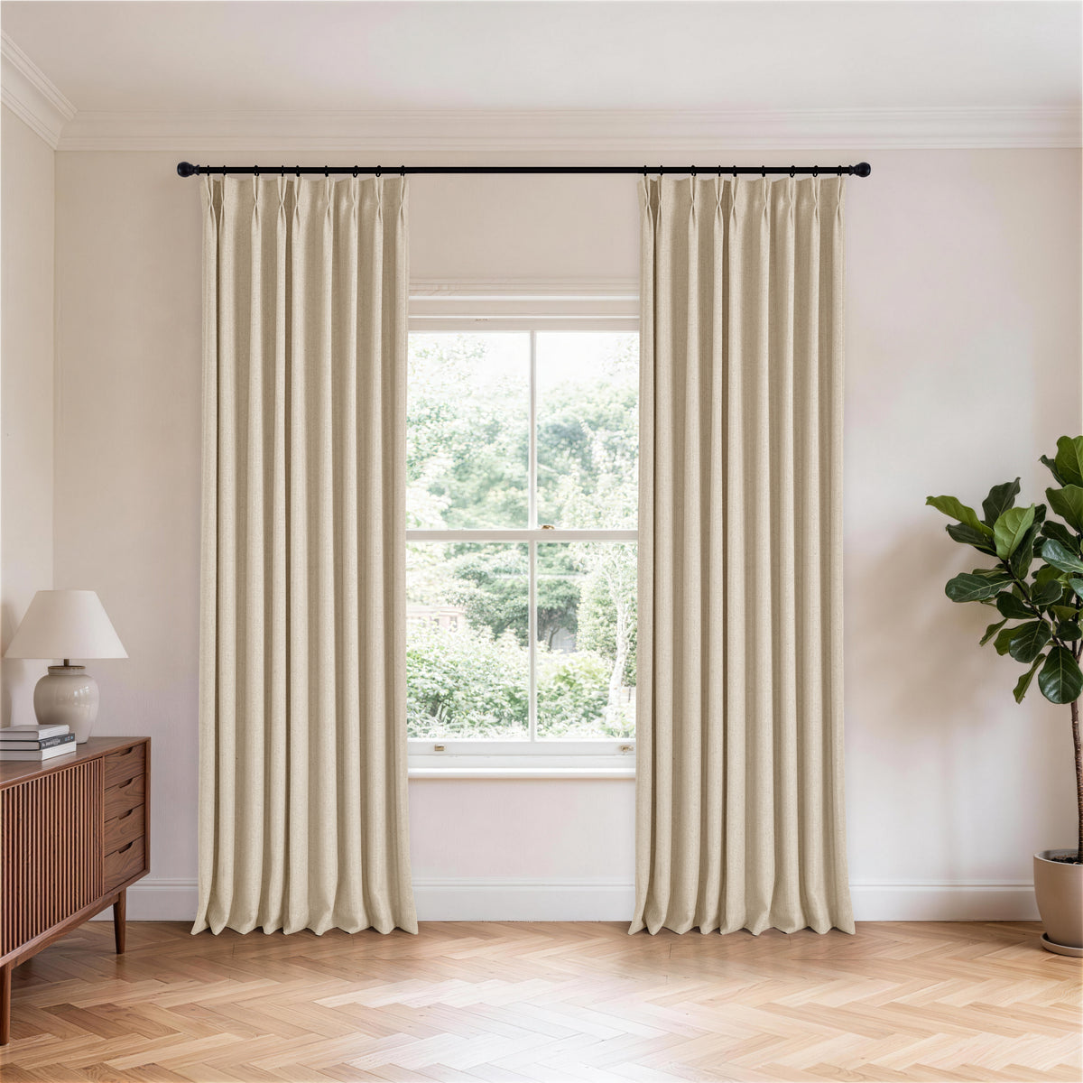 Ansel Slub Weave Curtains in Warm Greige, hanging in a room