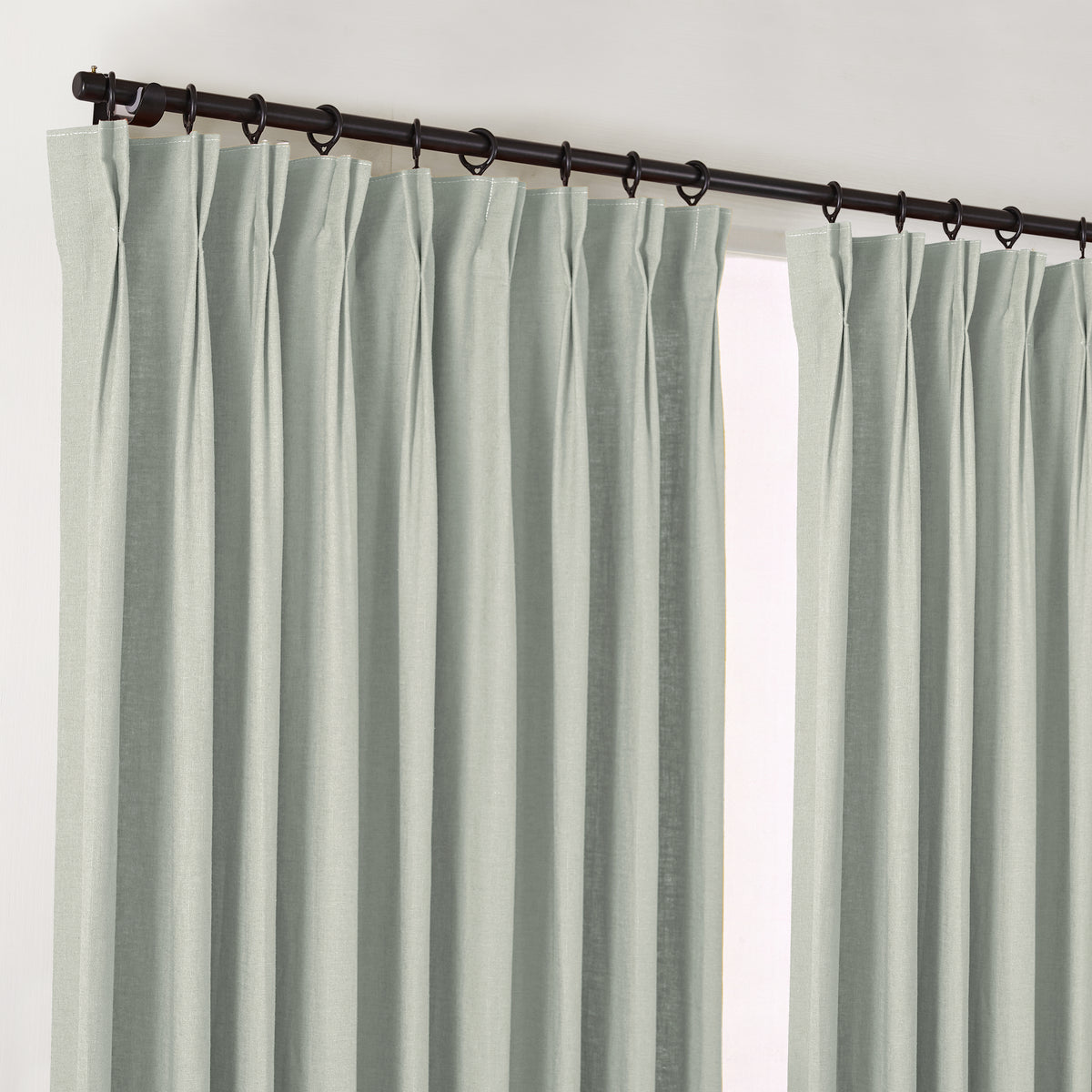 Edwina Linen-Cotton Curtains in Mist, hanging at the window