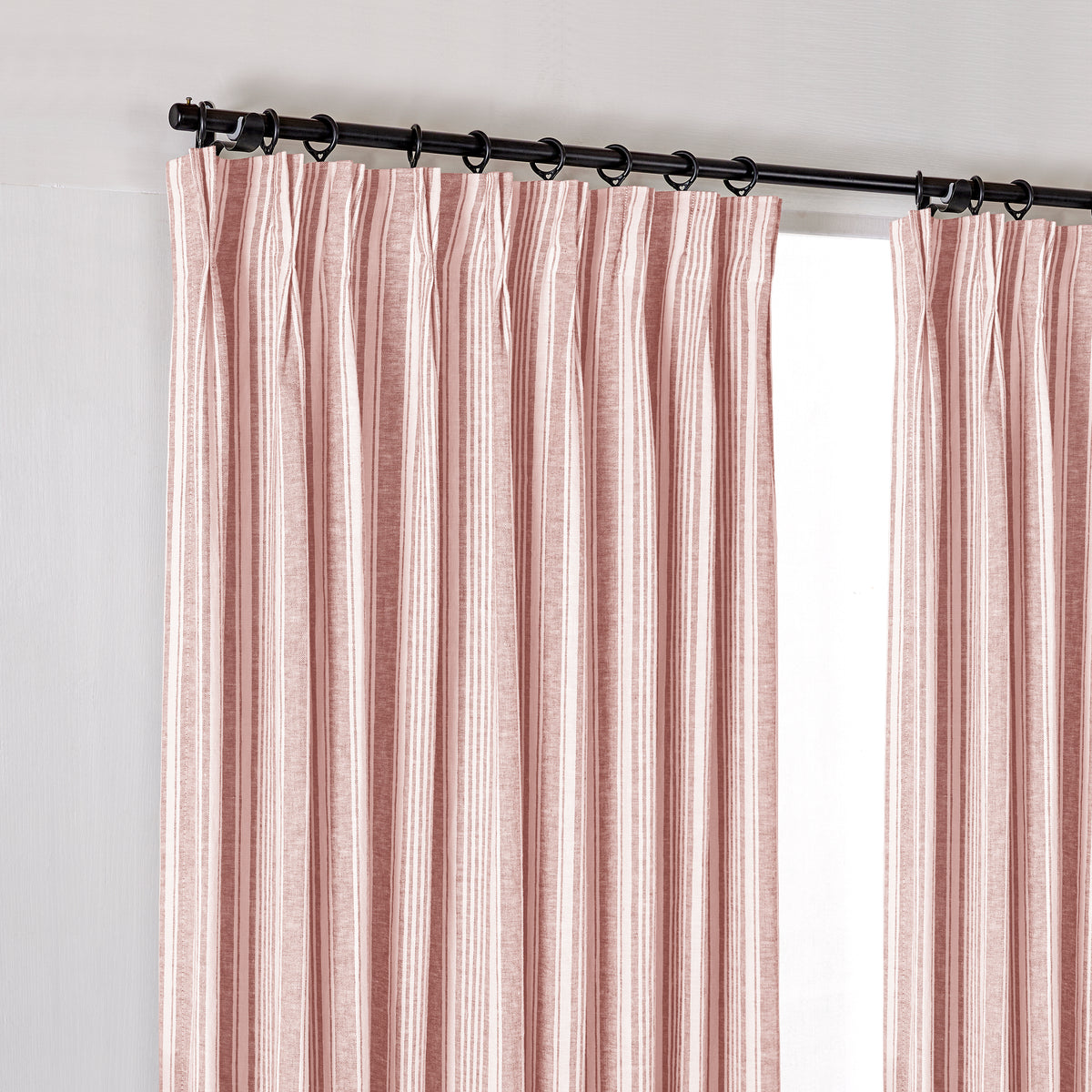 Carrick Striped Pure Linen Curtains in Madder Ticking, hanging at the window