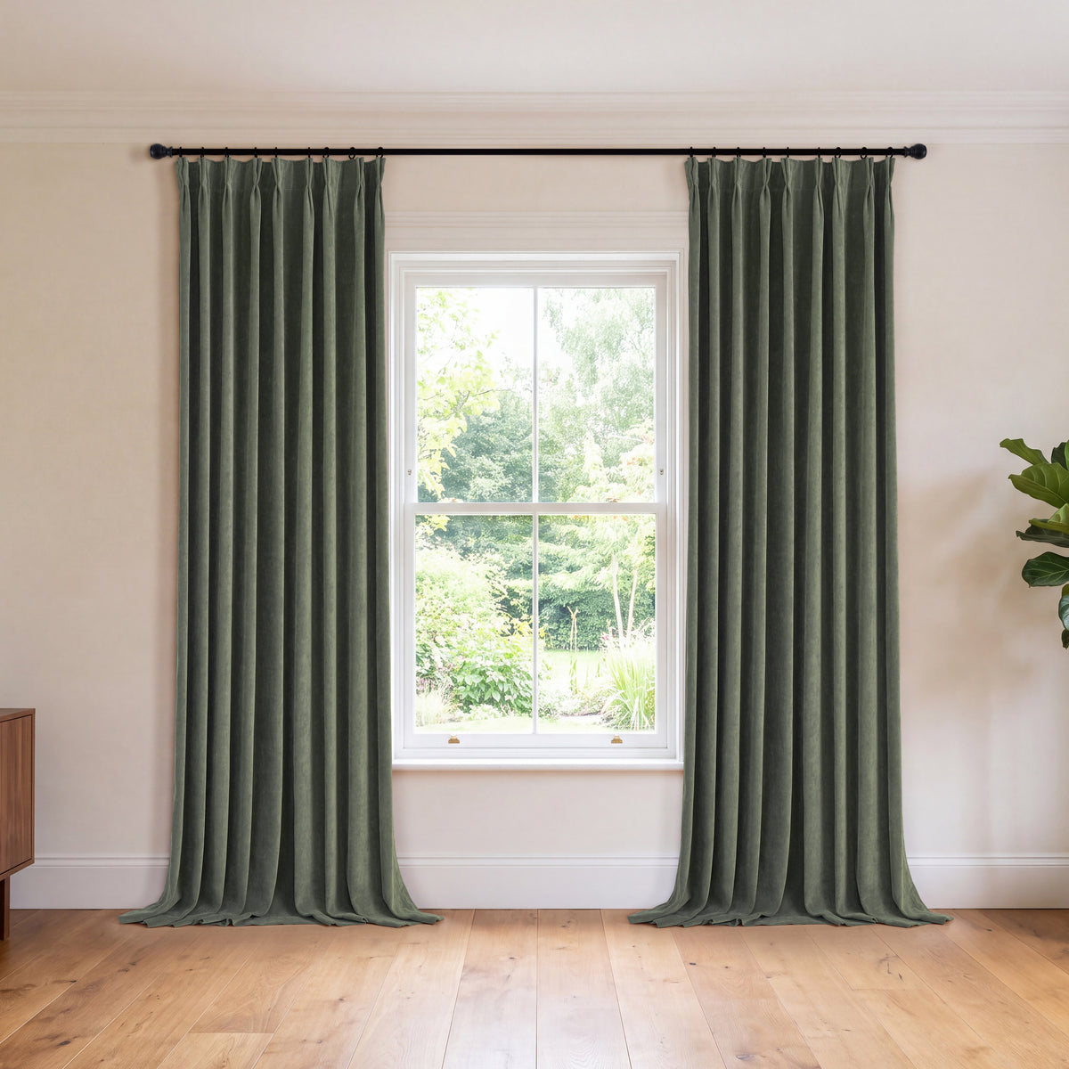 Genevieve Cloud-Soft Chenille Blackout Curtains in Forest, hanging in a room
