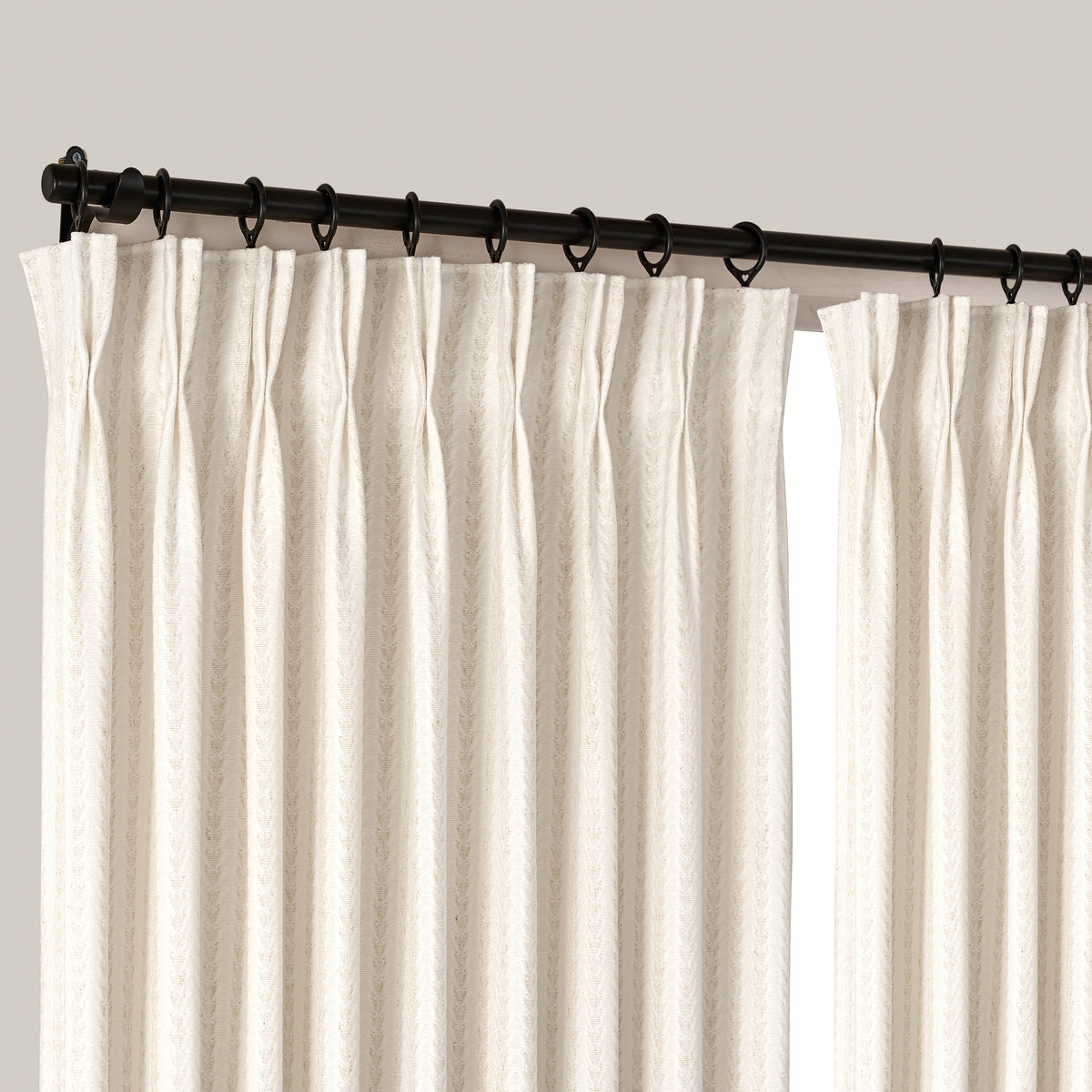 Fenimore Feather Stripe Weave Curtains in Natural, hanging at the window