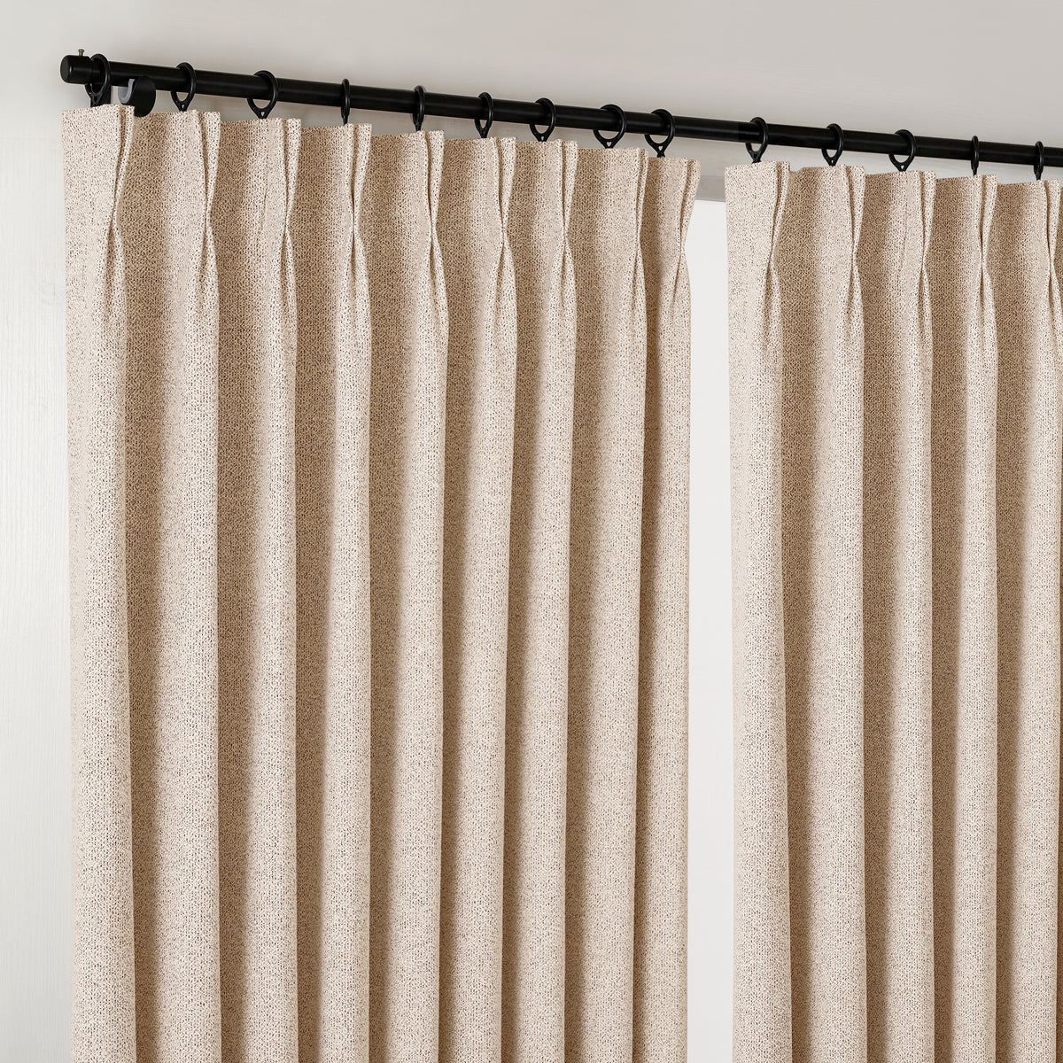 Pembroke Flecked Weave Curtains in Sand, hanging at the window