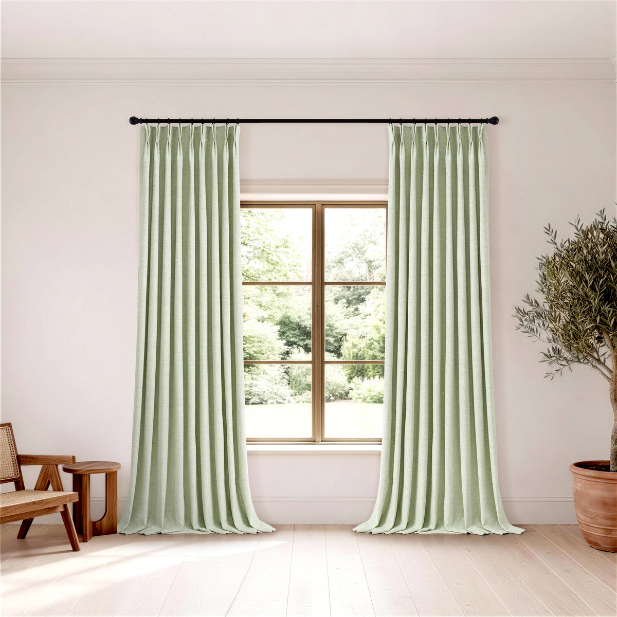 Pembroke Herringbone Weave Curtains in Pale Sage, hanging in a room